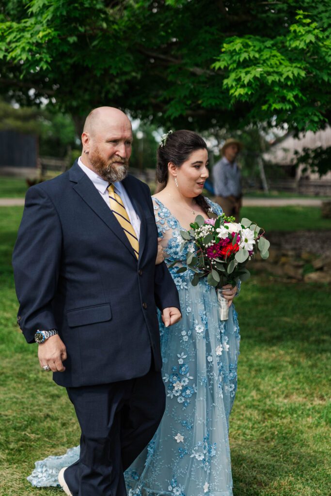 Bride and her father walk down the aisle at a Kentucky wedding. 