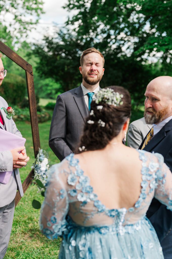 Groom gets emotional seeing the bride walk down the aisle at a Taylorsville, Kentucky wedding. 