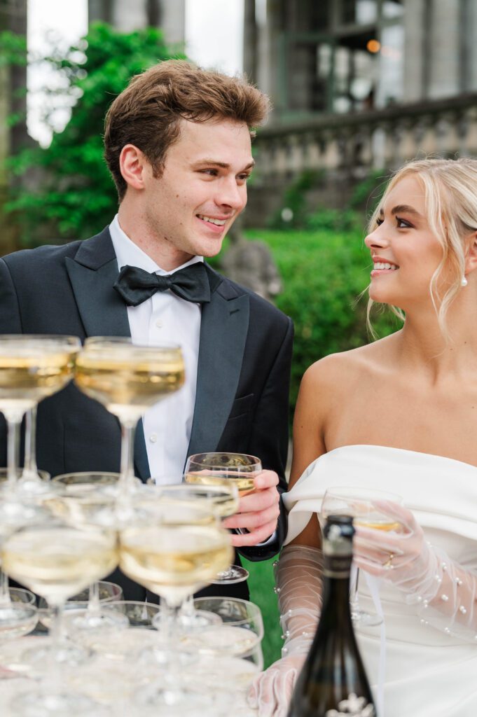 Bride and groom pour their champagne on their wedding day at Laurel Court in Cincinnati