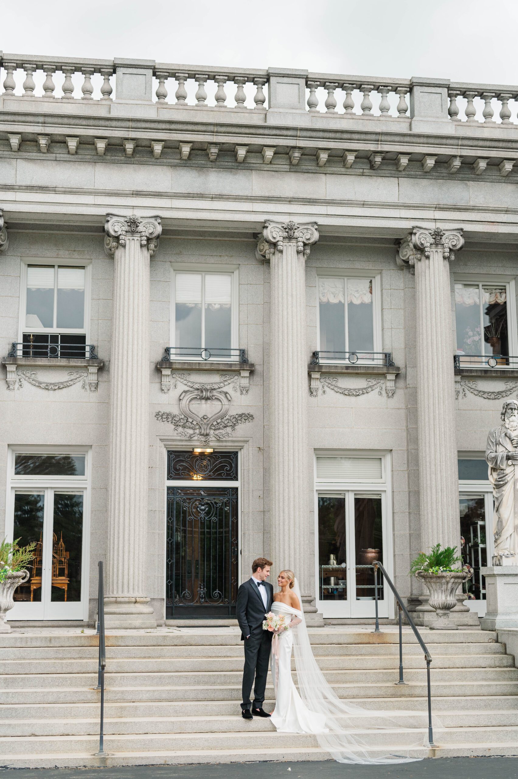 Bride and groom stand in from of Laurel Court in Cincinnati