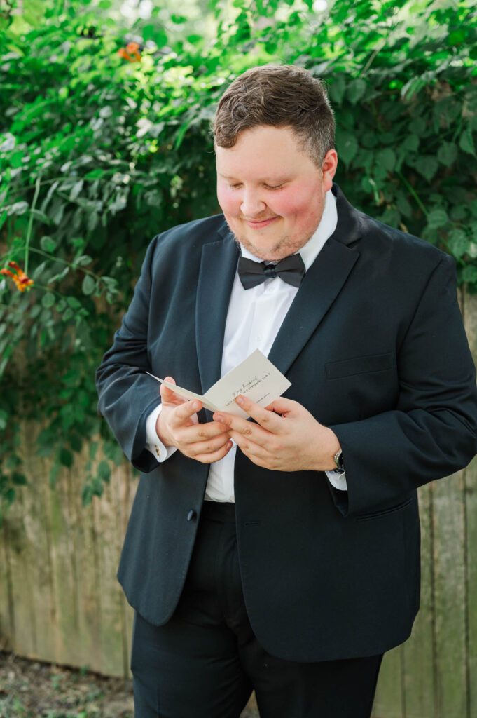 Groom reading a note from his future bride bride