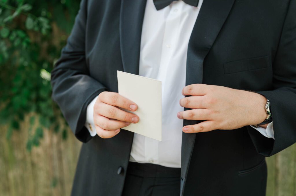 Groom reading a note from his future bride bride