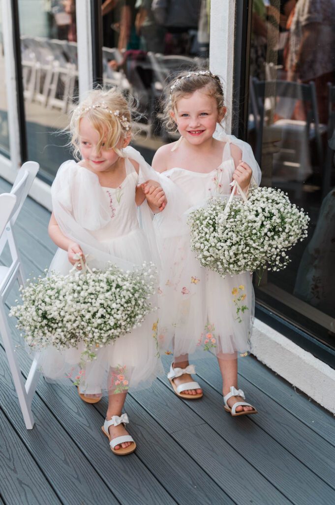 Flower girls walking down the aisle