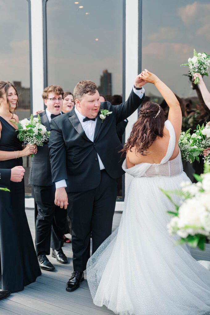 Bride and groom with the bridal party on their wedding day at The Jefferson
