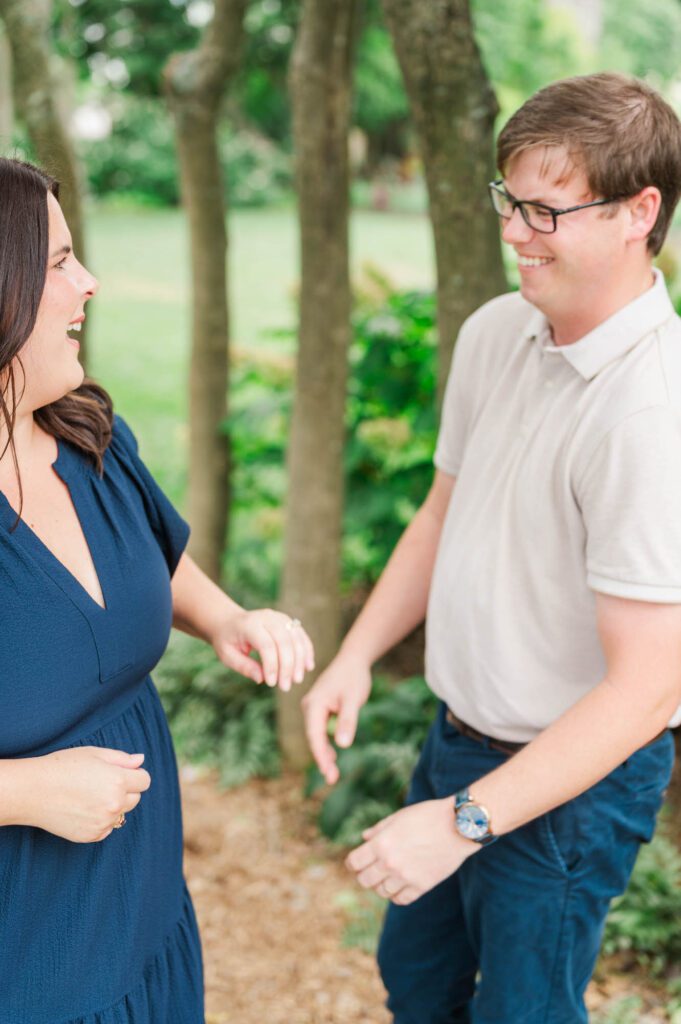 Couple stands amongst flowers at Yew Dell Botanical Gardens for their couples session in Louisville, KY