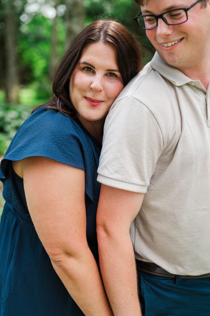 Couple stands amongst flowers at Yew Dell Botanical Gardens for their couples session in Louisville, KY