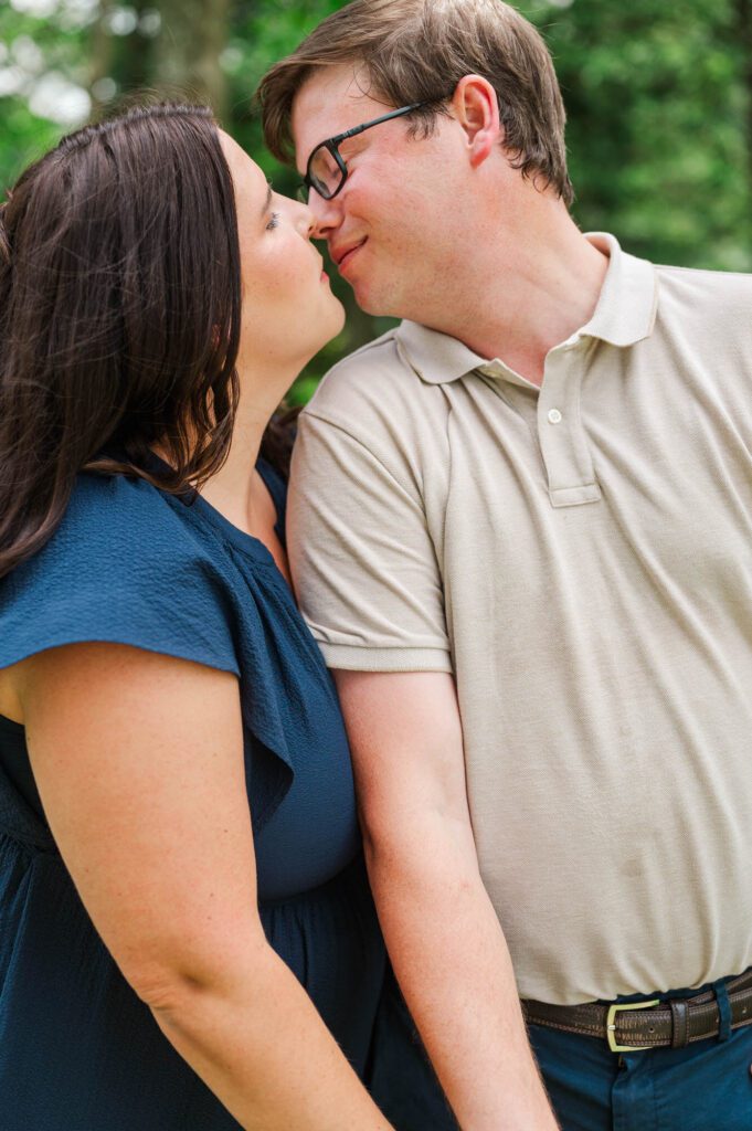 Couple stands amongst flowers at Yew Dell Botanical Gardens for their couples session in Louisville, KY