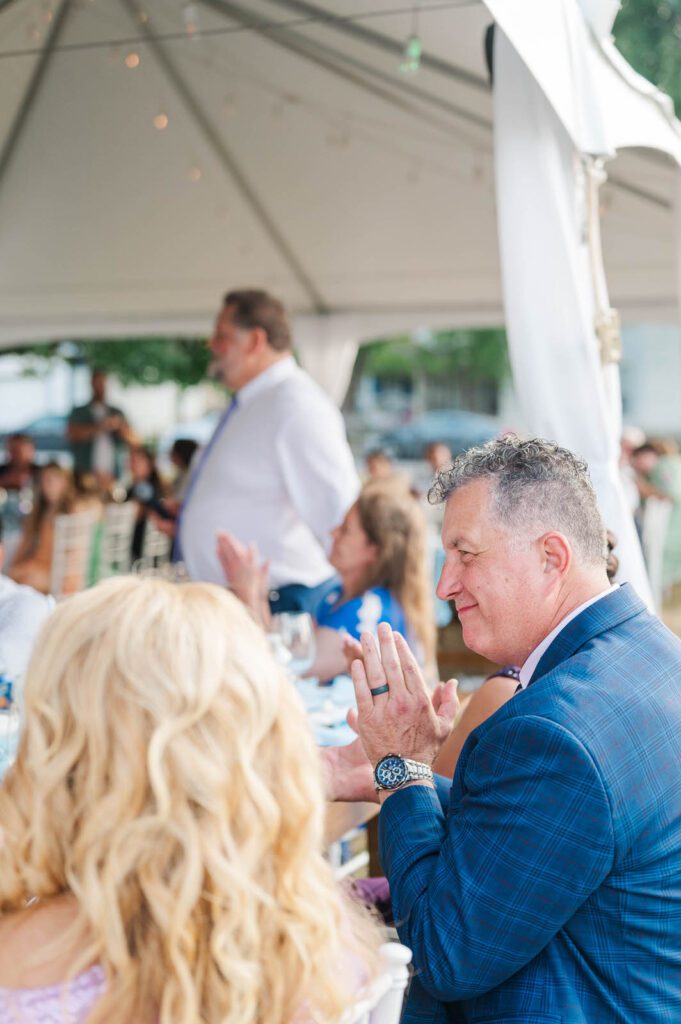 Father of the groom claps during toasts at Presley House Riverview