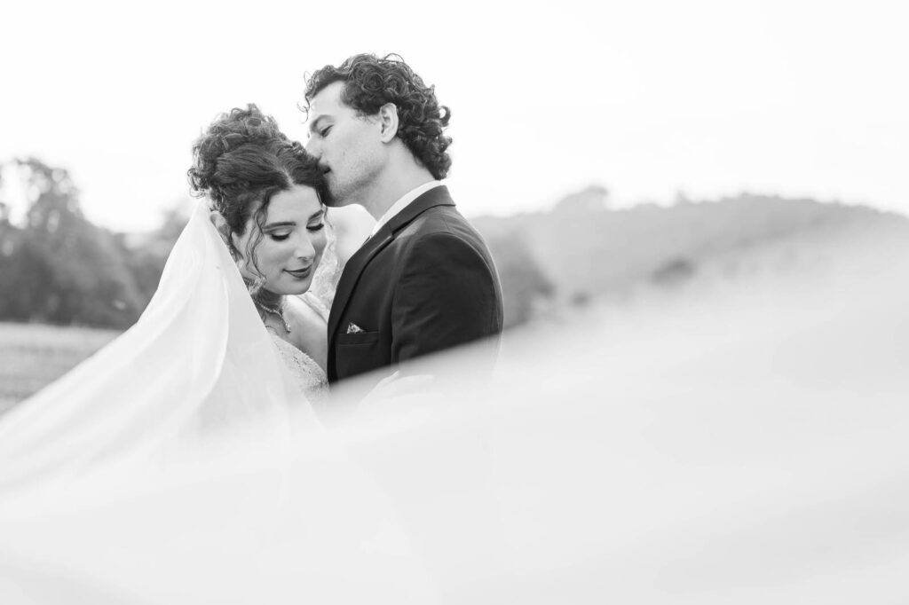 Bride and groom pose for portraits at Richwood on the River on their wedding day