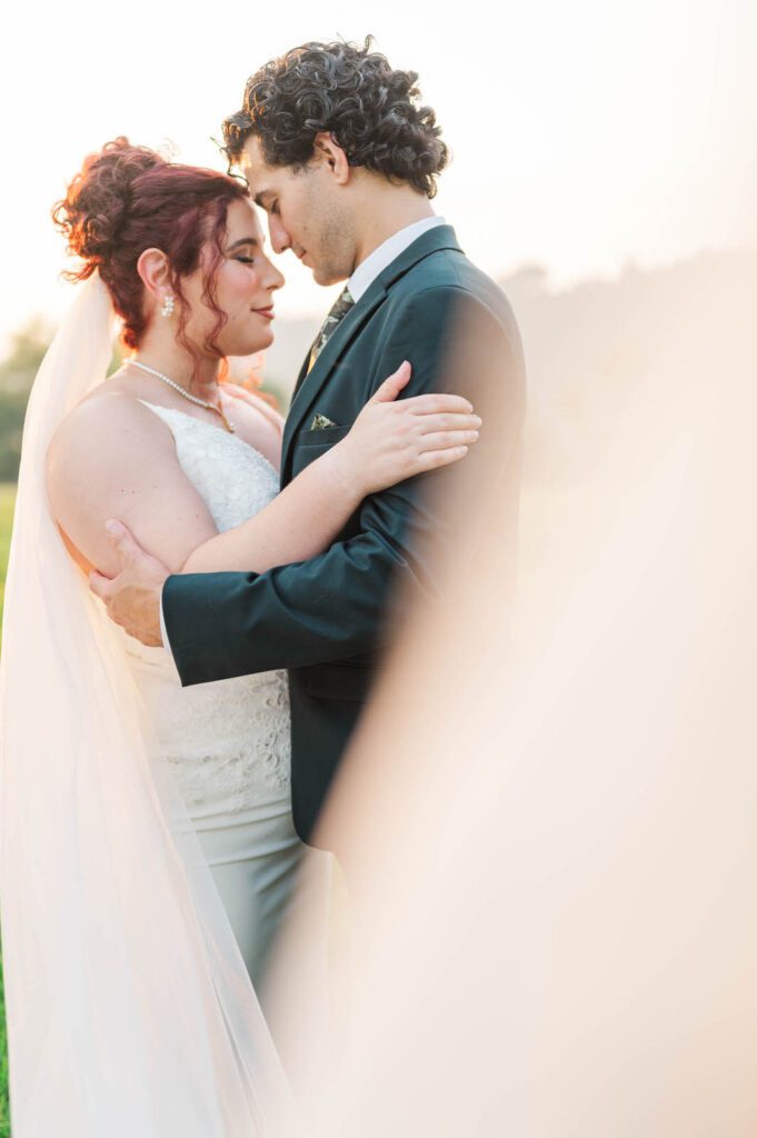 Bride and groom pose for portraits on their wedding day