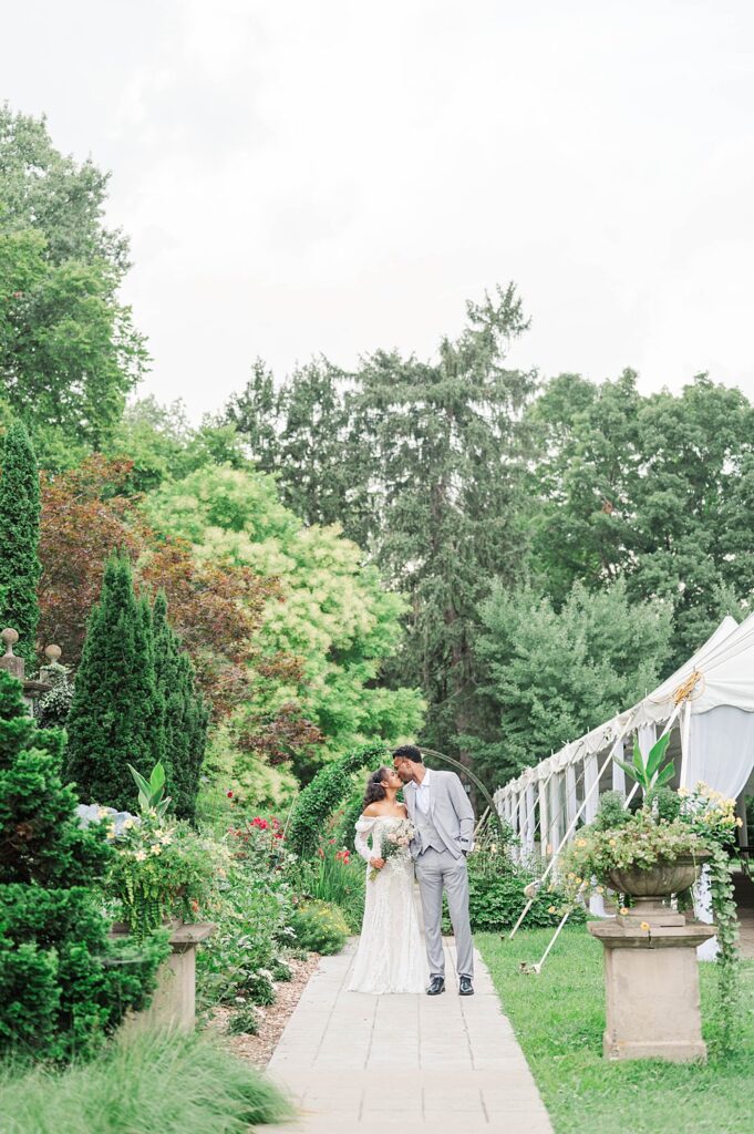 Couple smiles on wedding day at Whitehall House and Gardens