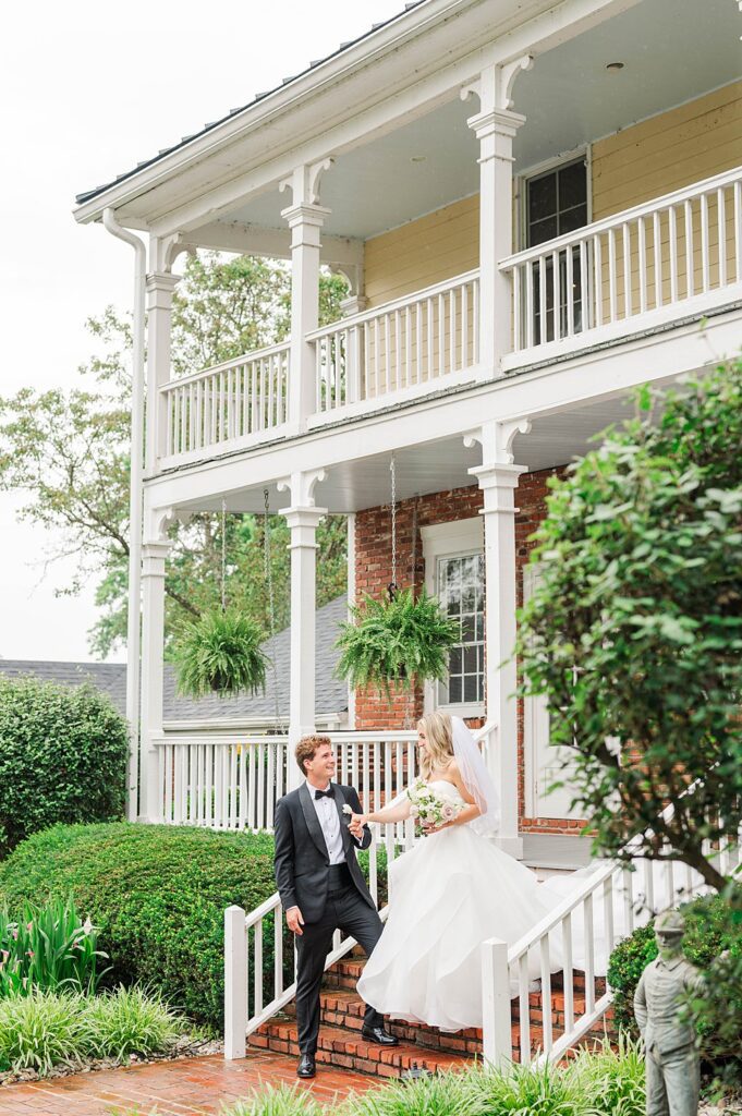 Couple walks down stairs on their wedding day at the Duncan Bradshaw House