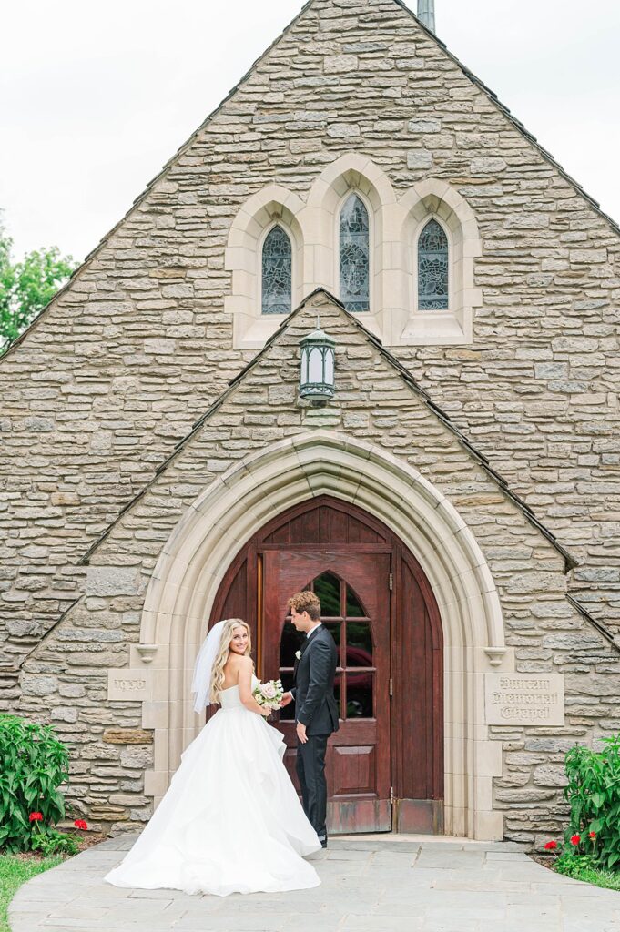Couple stands in front of Duncan Memorial Chapel for their ceremony