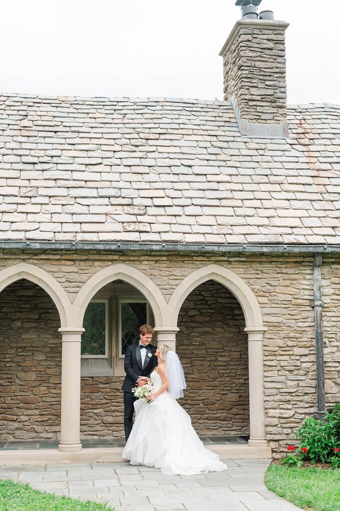 Couple stands in front of Duncan Memorial Chapel for their ceremony