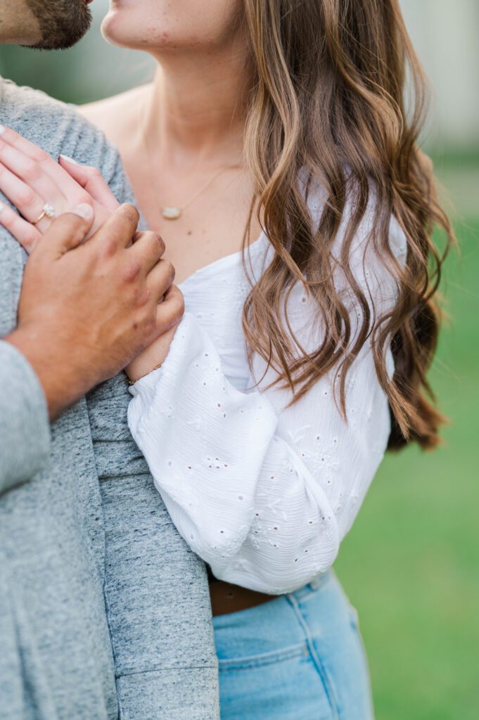 Couple holds hands during their engagement session at Anchorage Trail in Louisville, KY