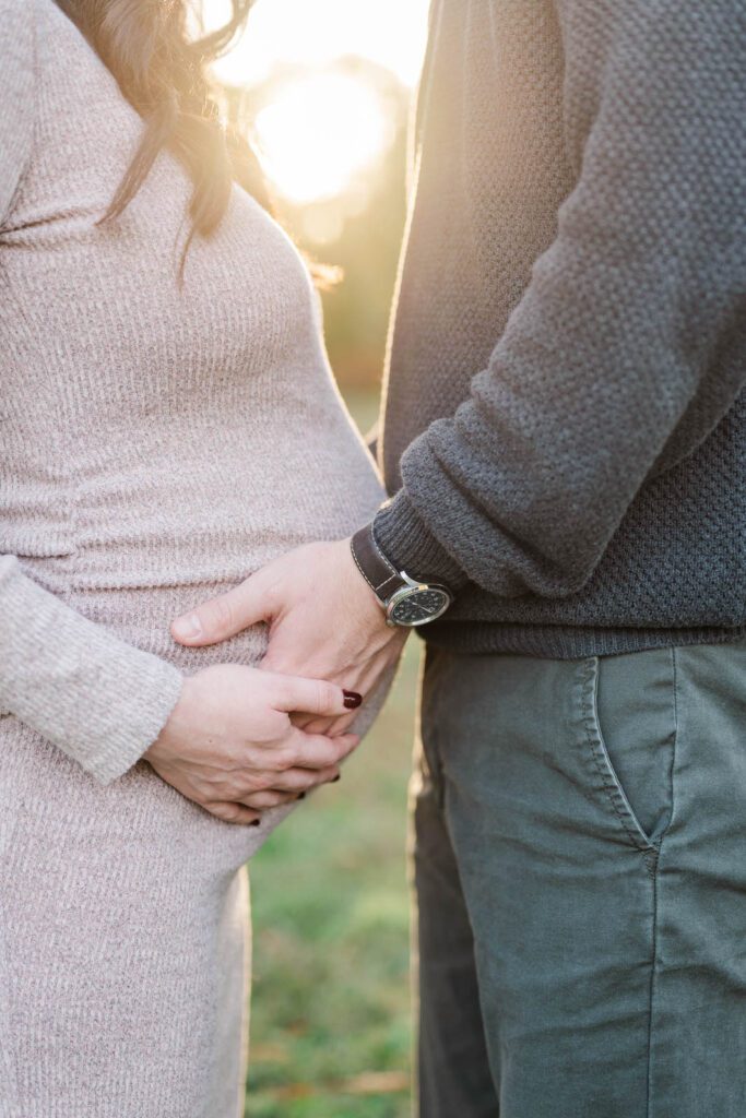 Close up of a baby bump during a maternity session at Cherokee Park