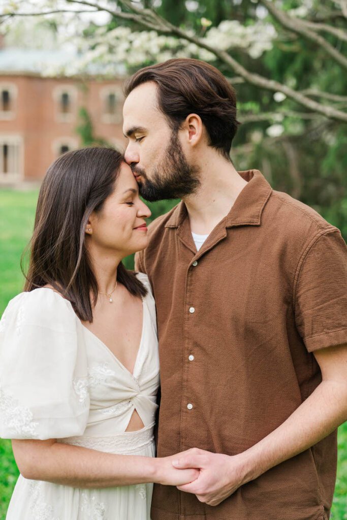 Couple embraces for their engagement session at Ashland, The Henry Clay Estate in Lexington, KY