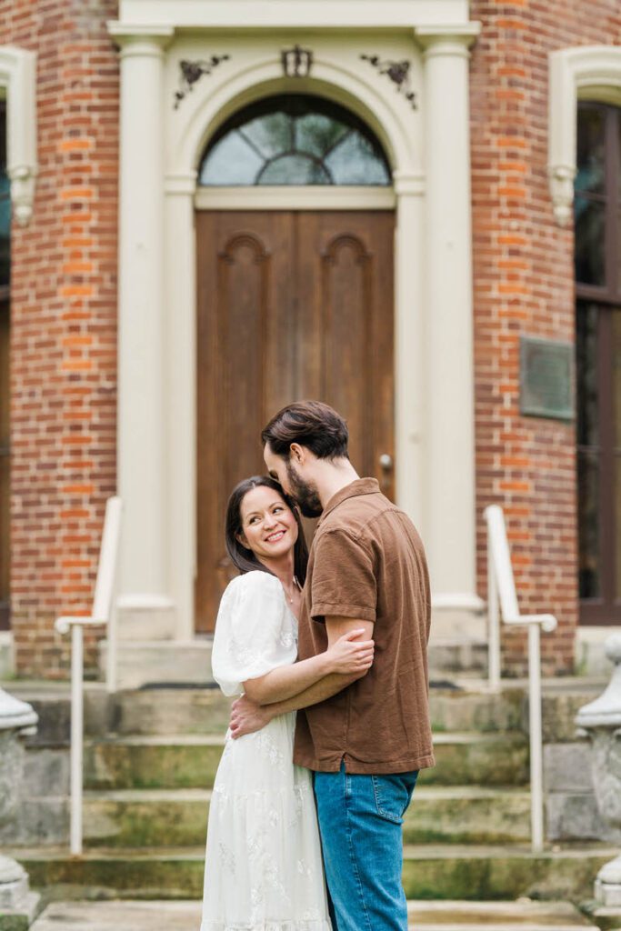 Couple embraces for their engagement session at Ashland, The Henry Clay Estate in Lexington, KY