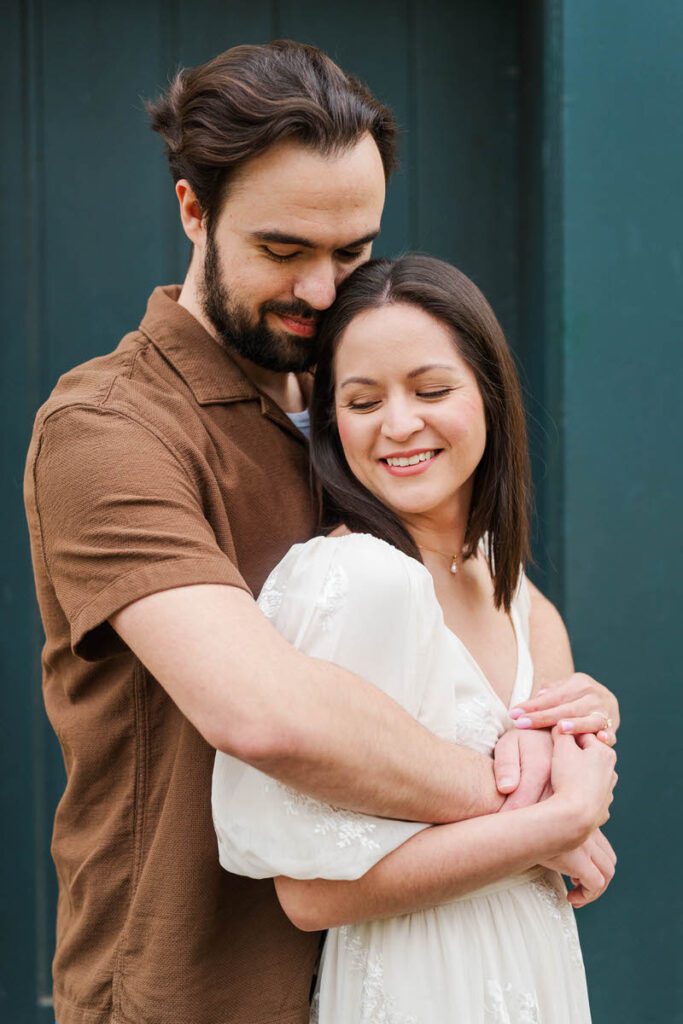 Couple embraces for their engagement session at Ashland, The Henry Clay Estate in Lexington, KY