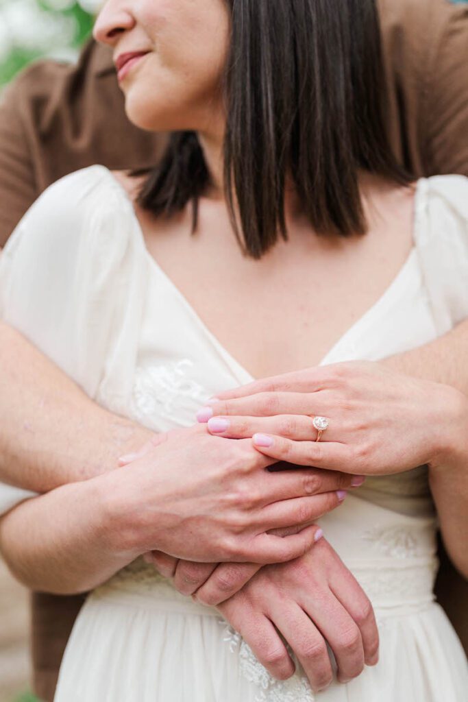 Couple shows off their engagement ring at their engagement session at Ashland, The Henry Clay Estate