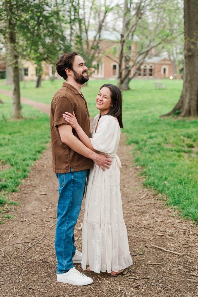 Couple laughs together for their engagement session at Ashland, The Henry Clay Estate