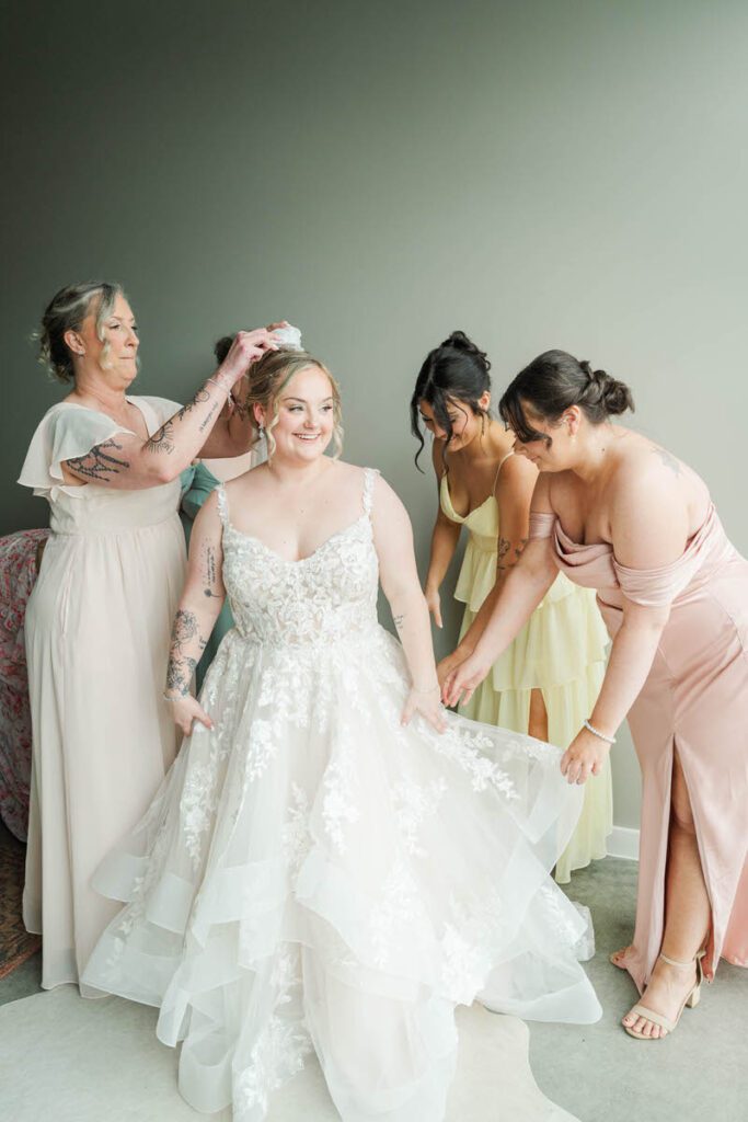 Bride gets into her wedding dress at The Ice House in Louisville, KY