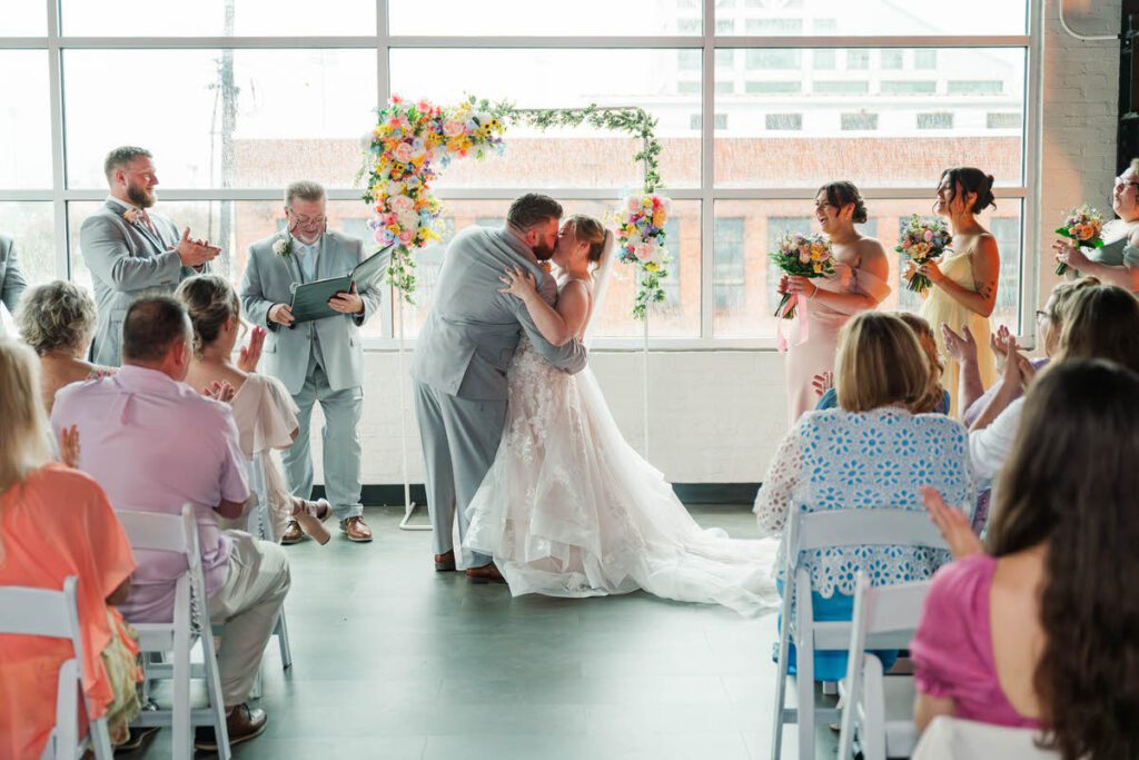 Bride and groom's first kiss at the Ice House in Louisville, KY