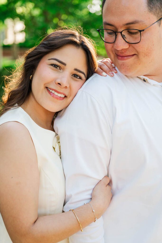 Bride looks at the camera for her engagement session in Norton Commons