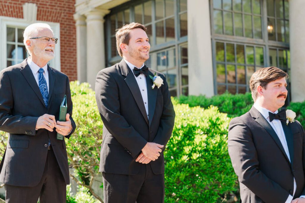 Groom watches his bride walk down the aisle at a Gardencourt wedding day