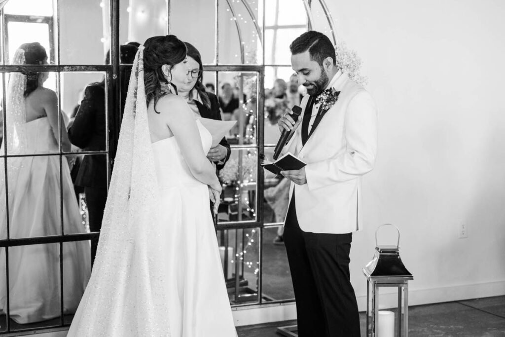 Bride and groom exchange vows on their wedding day at Mellwood Art Center