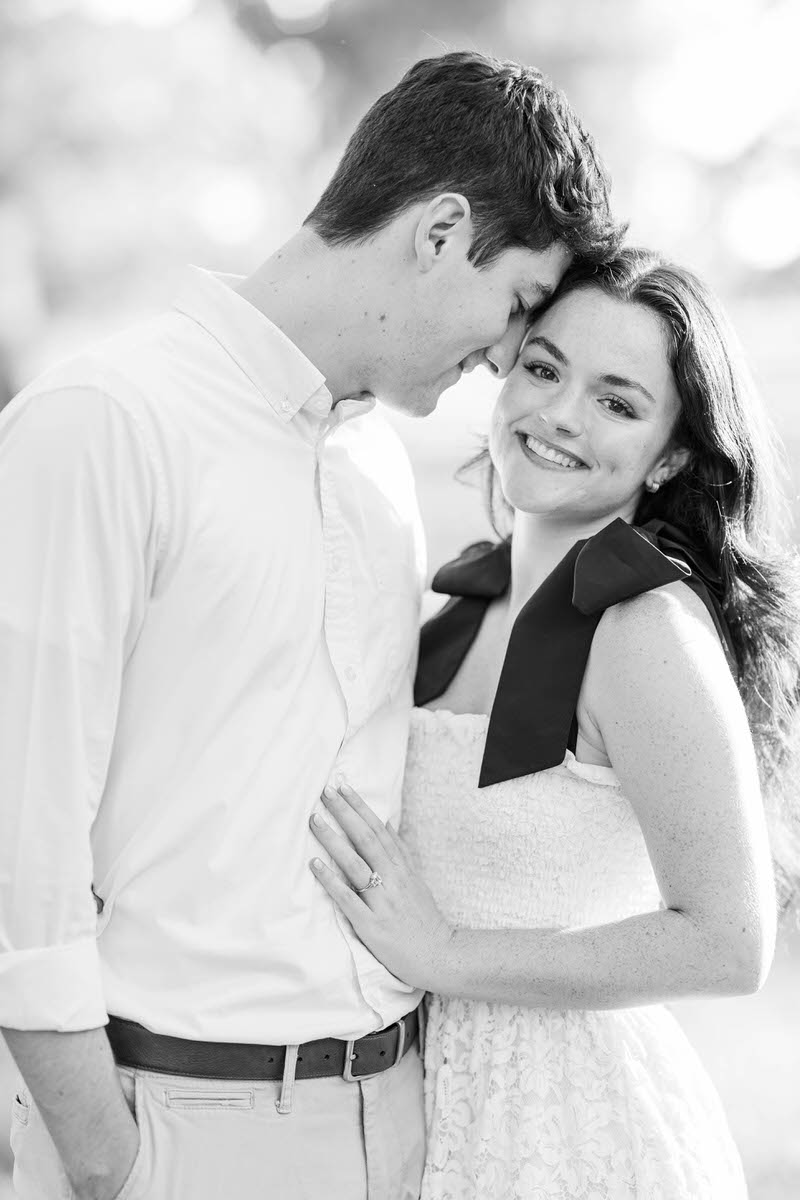 Couple poses at Anchorage Trail for their engagement session