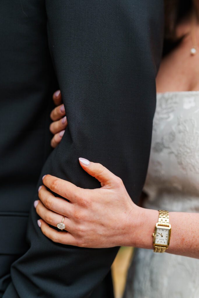 Couple shows off their ring at their Saint James Court engagement session.