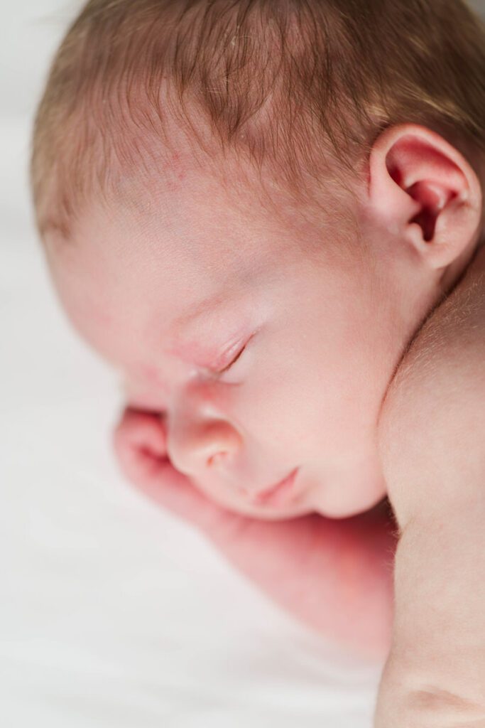 A close up image of a sleeping newborn baby.
Louisville In Home Newborn Session
Photos by Michelle Bordenkircher Photography