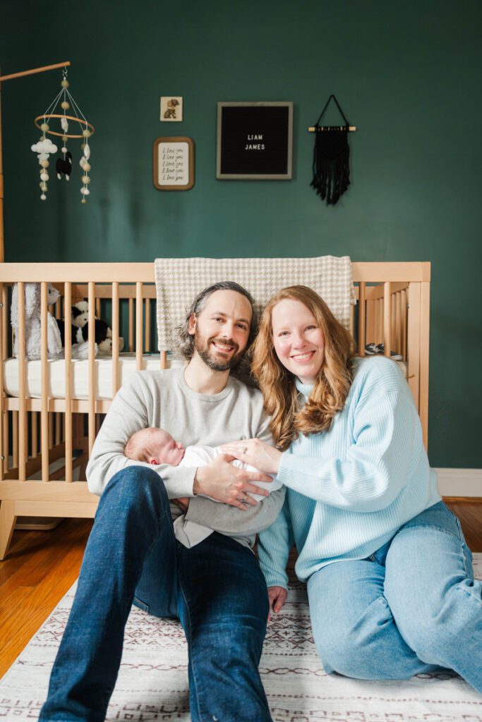 A new mom and dad sit with their new baby in the nursery.
Louisville In Home Newborn Session
Photos by Michelle Bordenkircher Photography