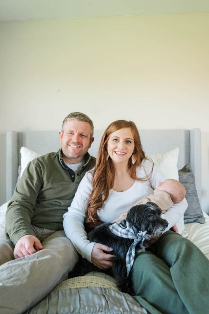 A family smiles for a photo together during their Louisville In-Home newborn session
Photos by Michelle Bordenkircher Photography