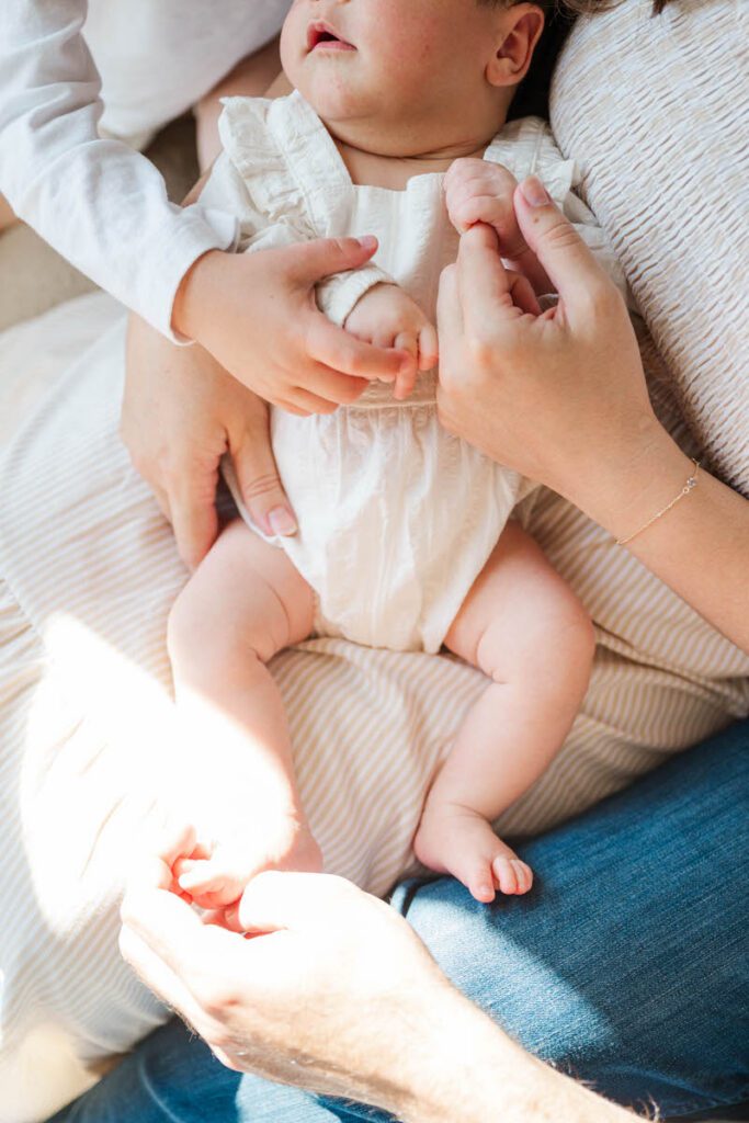 A mom and dad snuggle their sweet baby during their Louisville In-Home newborn session
Photos by Michelle Bordenkircher Photography