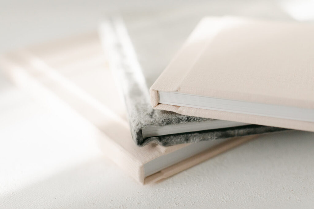 Heirloom albums make for beautiful baby books after a baby's first year photography plan.