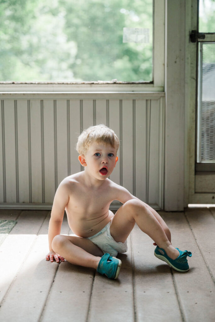 Baby in a diaper during his in-home Louisville family photo session