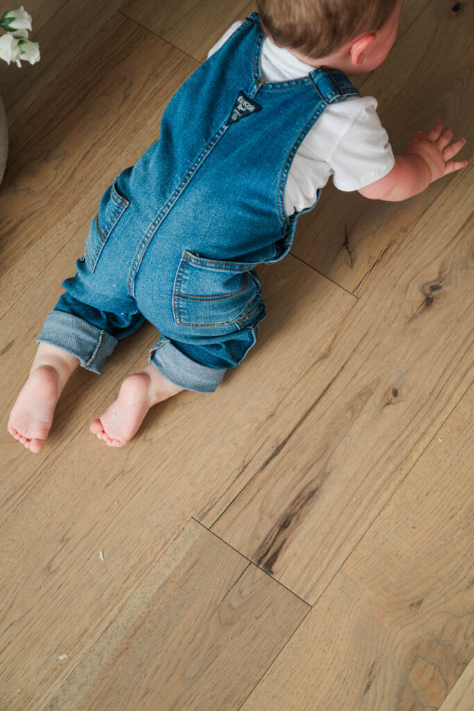 A Louisville baby crawls away during his nine month milestone session in a baby's first year photography plan. 
