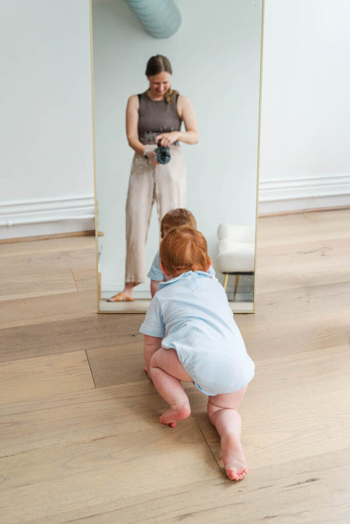 Michelle Bordenkircher takes a picture of an 8 month old baby crawling during his Louisville mini session.