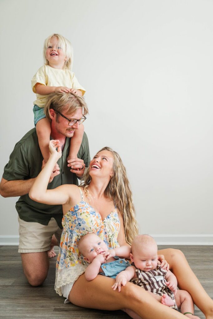 Family plays together during their in-home family session.