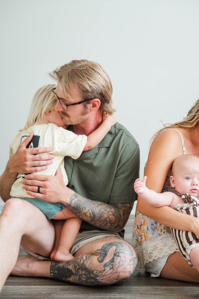 Toddler gives his dad a big hug during their in-home family photo session.