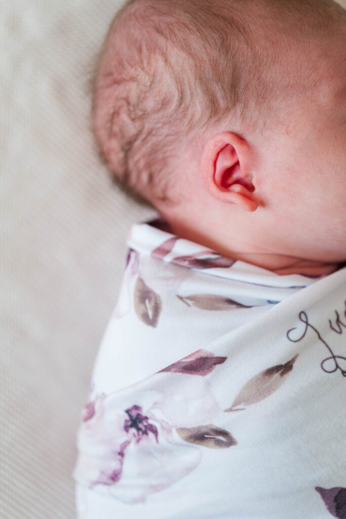 A close-up photo of baby's ear during her newborn session.
