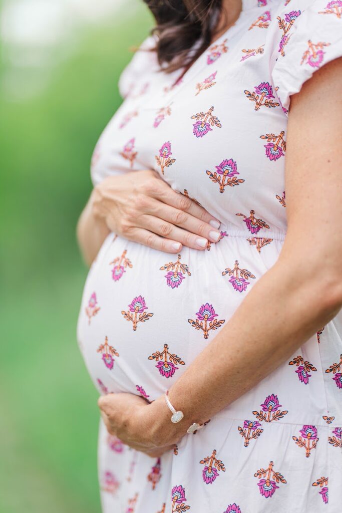 A close-up photo of an expecting mother's baby bump during her maternity session.
