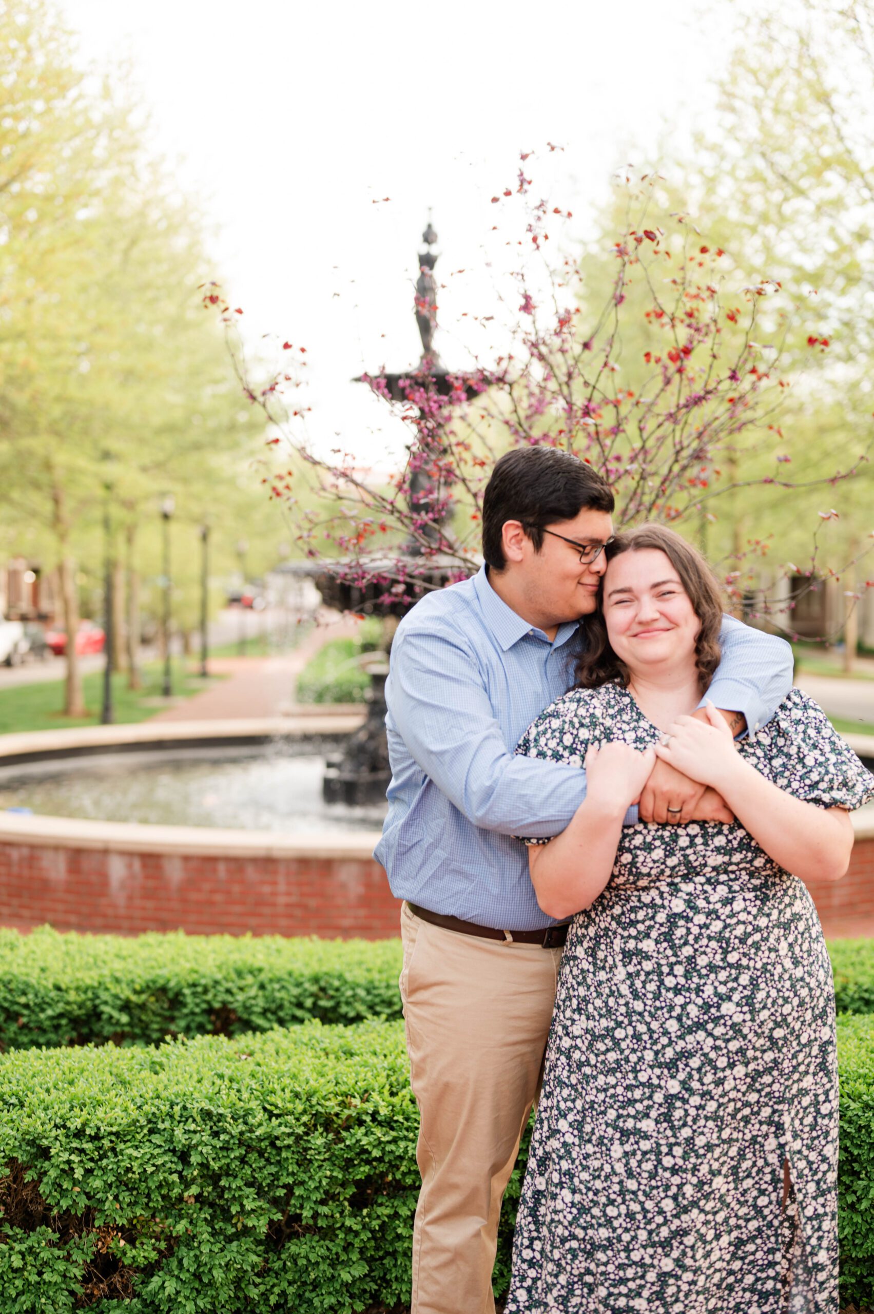 Husband and wife pose in Norton Commons for their couples session