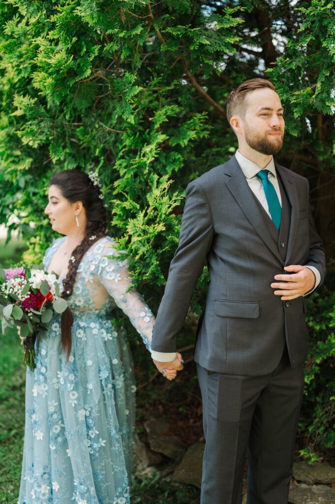 Bride and groom do a first touch on their Kentucky farm wedding day. 