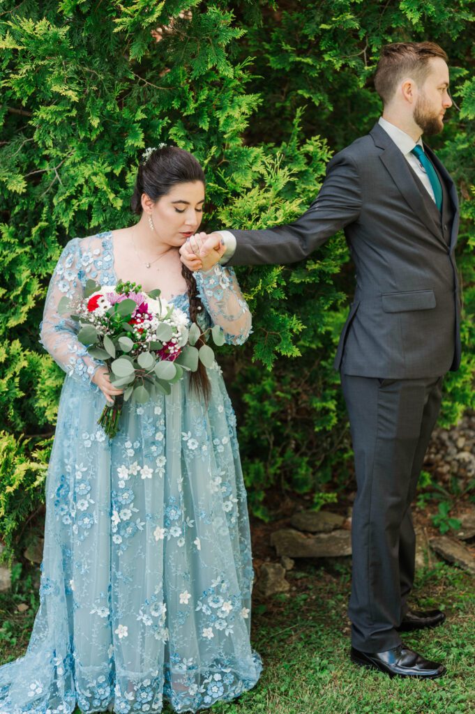 Bride and groom do a first touch on their Kentucky farm wedding day. 