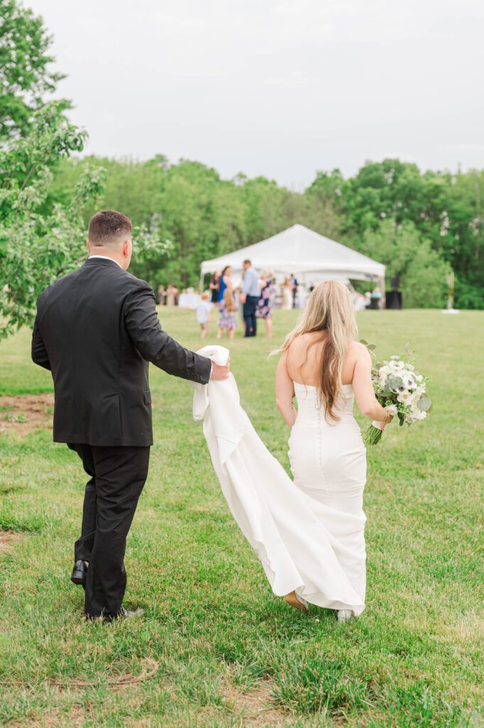 Bride and groom walk to their wedding reception near Lexington, KY