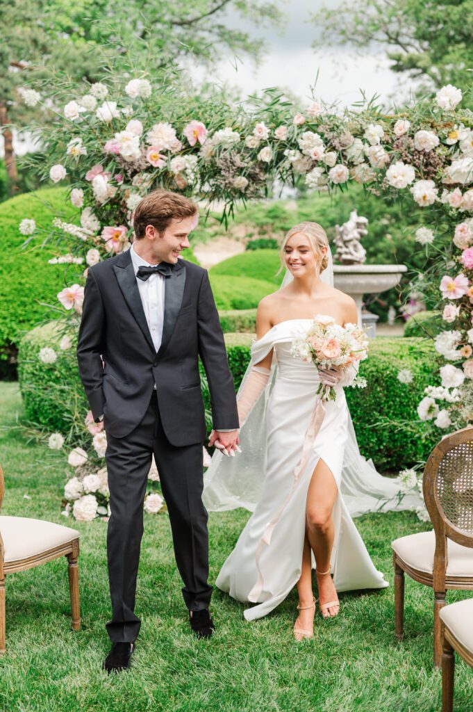 Bride and groom walk down the aisle