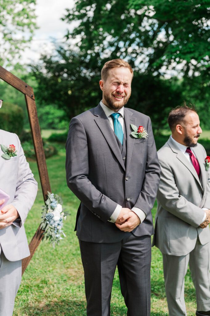 Groom gets emotional seeing the bride walk down the aisle at a Taylorsville, Kentucky wedding. 